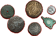 Some metal detecting coin finds are displayed for artistic purposes